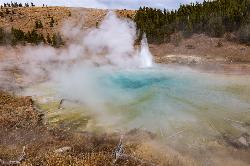 Imperial Geyser erupting on a cloudy fall afternoon courtesy of NPS / Jacob W. Frank↗