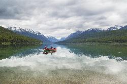 Paddlers on Bowman Lake courtesy of GlacierNPS&nearr; (Public domain&nearr;)