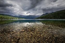 Moody light over Kintla Lake courtesy of GlacierNPS&nearr; (Public domain&nearr;)