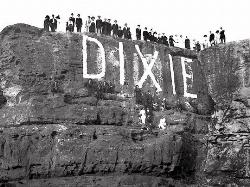 The Sugarloaf newly painted with DIXIE, written over the 1914 lettering added by freearenas (Public Domain&nearr;)