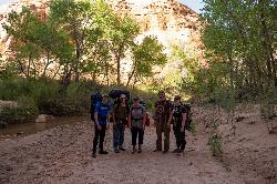 Family at Coyote Gulch wash courtesy of Jake Law↗