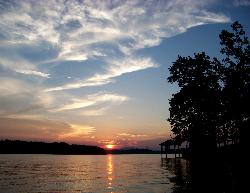 Sunset over the lake with a shelter silhouetted on the bank courtesy of Idawriter&nearr; (CC BY-SA 3.0&nearr;)