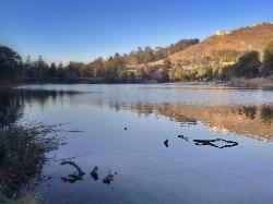 The lake with the hillside rising behind it courtesy of Sharon Hahn Darlin&nearr; (CC BY 2.0&nearr;)