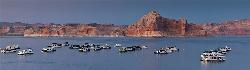 Houseboats at Wahweap Marina with a butte behind courtesy of flamouroux&nearr; (CC BY-SA 2.0&nearr;)