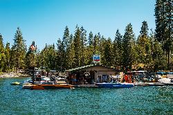 Boats tied at the dock by the lakeside store at Millers Landing