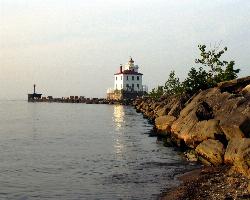 The Fairport Harbor West Breakwater Light at the east end of the beach courtesy of Pbalson8204 at English Wikipedia&nearr; (Public domain&nearr;)