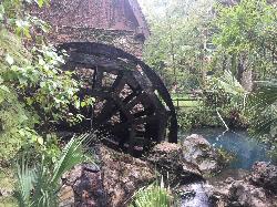 The millhouse waterwheel, which once generated electricity for the campground from the spring run. courtesy of Berwin&nearr; (CC BY-SA 4.0&nearr;)