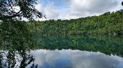 Round Lake in late summer, the park's second meromictic lake and a National Natural Landmark courtesy of DASonnenfeld&nearr; (CC BY-SA 4.0&nearr;)