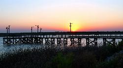Sunset from the lighted fishing pier on the north shore of Lake Arrowhead. courtesy of Larry D. Moore&nearr; (CC BY 4.0&nearr;)