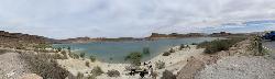 Panorama of the cobble beach with swimmers out in the shallows courtesy of Viking Warrior Princess&nearr; (CC BY 2.0&nearr;)