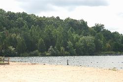 Sand and waterline at the park beach, with the buoy line marking the edge of the swimming area. courtesy of Virginia State Parks staff&nearr; (CC BY 2.0&nearr;)