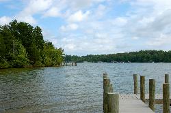 A dock on the public side of Lake Anna, looking across to the wooded far shore. courtesy of Virginia State Parks staff&nearr; (CC BY 2.0&nearr;)