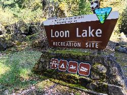 The BLM entrance sign on Loon Lake Road, with icons for picnicking, camping, swimming and boat launc courtesy of Bureau of Land Management Oregon and Washington from Portland, America&nearr; (Public domain&nearr;)