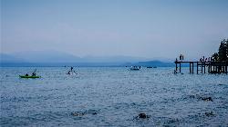 Kayakers and paddleboarders off the park pier on a hazy summer afternoon courtesy of Oscar Vasquez / California Department of Parks and Recreation&nearr; (Public domain&nearr;)