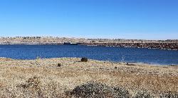 Pueblo Dam seen from the south. Kestrel Pond lies below it in the Rock Canyon area. courtesy of Jeffrey Beall&nearr; (CC BY 4.0&nearr;)