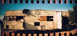 A gutted travel trailer abandoned in the desert at Slab City. courtesy of Kevin Dooley from Chandler, AZ, USA&nearr; (CC BY 2.0&nearr;)