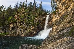 Running Eagle Falls seen from the end of the accessible trail courtesy of GlacierNPS&nearr; (Public domain&nearr;)