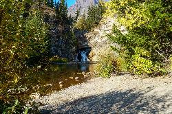 Shoreline of Two Medicine Creek below the falls courtesy of GlacierNPS&nearr; (Public domain&nearr;)