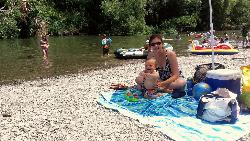 Beating the summer heat under an umbrella on the rocky, forested shore at Steelhead Beach courtesy of seanmfreese&nearr; (CC BY 2.0&nearr;)