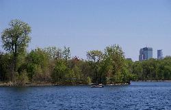 Cedar Lake looking toward the downtown Minneapolis skyline. courtesy of AlexiusHoratius&nearr; (CC BY-SA 3.0&nearr;)