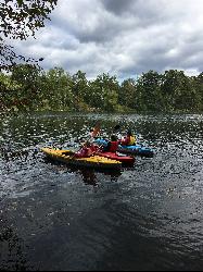 Kayaking on Pinchot Lake courtesy of AmPartnership&nearr; (CC BY-SA 4.0&nearr;)