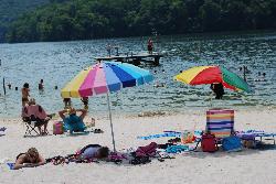 Swimmers inside the buoy line with the swim dock and diving board beyond courtesy of Virginia State Parks staff&nearr; (CC BY 2.0&nearr;)