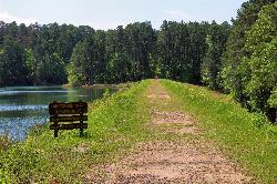The Lakeshore Trail crossing the earthen dam the CCC built to make the lake courtesy of Larry D. Moore&nearr; (CC BY 4.0&nearr;)