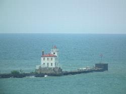 The West Breakwater Light out on the breakwall, the landmark visible northwest from the swim beach courtesy of Erik Drost&nearr; (CC BY 2.0&nearr;)
