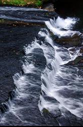 Water fanning across the stepped bedrock in the narrow gorge. courtesy of Gary Halvorson, Oregon State Archives&nearr; (Attribution)