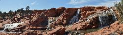 Panorama of the upper Gunlock spillway running across red slickrock courtesy of Panaram 