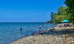 Visitors spread out on the beach on a warm May afternoon at the park. courtesy of Andre Carrotflower&nearr; (CC BY-SA 4.0&nearr;)