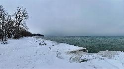 The same Lake Ontario shoreline iced over in January. courtesy of Andre Carrotflower&nearr; (CC BY-SA 4.0&nearr;)