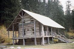 The Forest Service guard station at Salmon La Sac, a log building from the 1930s still standing near courtesy of U.S. Forest Service- Pacific Northwest Region&nearr; (Public domain&nearr;)