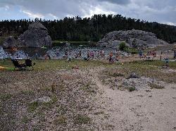 Swimmers in the shallows at Sylvan Lake in the Black Hills. courtesy of Runner1928&nearr; (CC BY-SA 4.0&nearr;)