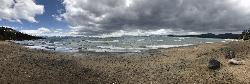 Wide panorama across the length of the beach at Kings Beach State Recreation Area. courtesy of Reportzite&nearr; (CC BY-SA 4.0&nearr;)