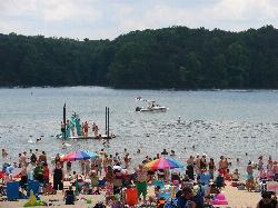 Swimmers inside the roped area while a boat runs the open water just beyond it. courtesy of Virginia State Parks&nearr; (CC BY 2.0&nearr;)