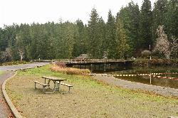 The lake and the park bridge that anglers fish from courtesy of Photo by Joe Mabel&nearr; (CC BY-SA 4.0&nearr;)