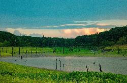 Sunset over a shallow upper arm of Mark Twain Lake courtesy of Tony Webster&nearr; (CC BY 2.0&nearr;)