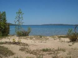 Open sand and shallow water on Crystal Lake near the rail trail courtesy of Retaildesigner (talk)&nearr; (Public domain&nearr;)