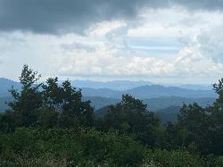 Ridges of the Cohuttas seen from Conasauga Road, one of the gravel approaches toward the lake. courtesy of Tamparitus&nearr; (CC BY-SA 4.0&nearr;)