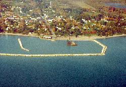 Aerial view of the harbor, the breakwall and the shoreline at Lexington courtesy of U.S. Army Corps of Engineers, photographer not specified or unknown&nearr; (Public domain&nearr;)