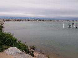 Sheltered water inside the breakwall, with people walking out along the stone courtesy of Ken Lund from Reno, Nevada, USA&nearr; (CC BY-SA 2.0&nearr;)