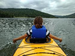 Kayaking on Quaker Lake with the beach on the far shore courtesy of alex ranaldi&nearr; (CC BY-SA 2.0&nearr;)