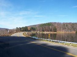 The lakeside road at the NY 280 and ASP Route 3 split near Quaker Lake courtesy of andyarthur&nearr; (CC BY 2.0&nearr;)