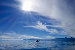 A kayaker on the water off this stretch of shoreline courtesy of BitBoy&nearr; (CC BY 2.0&nearr;)