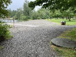 The gravel car-top boat launch sloping into the water beside the picnic lawn courtesy of Steven Pavlov&nearr; (CC BY-SA 4.0&nearr;)