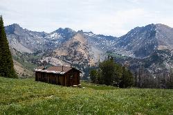 Pioneer Cabin with the Pioneer Mountains behind it courtesy of Brian J Kelly&nearr; (CC BY 2.0&nearr;)