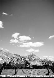The painted roof of Pioneer Cabin facing the Pioneer Mountains courtesy of EmilyBergquist&nearr; (CC BY 2.0&nearr;)