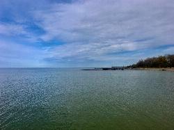 Looking east along the shore from the end of one of the rock jetties courtesy of Andre Carrotflower&nearr; (CC BY-SA 4.0&nearr;)