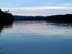 Sunset over the water at Parkers Creek, across the lake from White Oak courtesy of bobistraveling&nearr; (CC BY 2.0&nearr;)